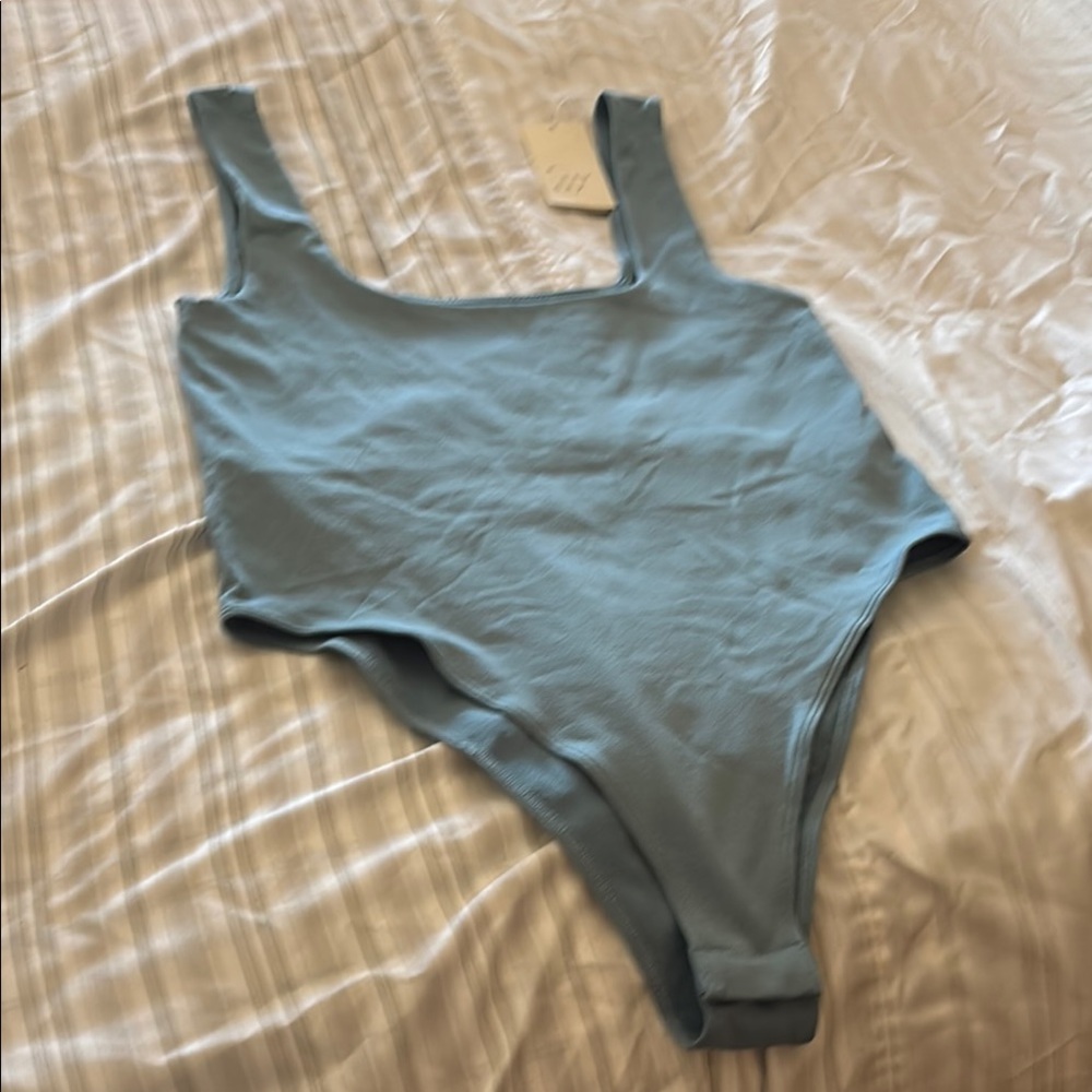 a new day teal bodysuit